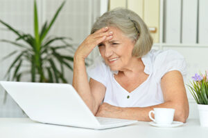 Portrait of a senior woman working at table